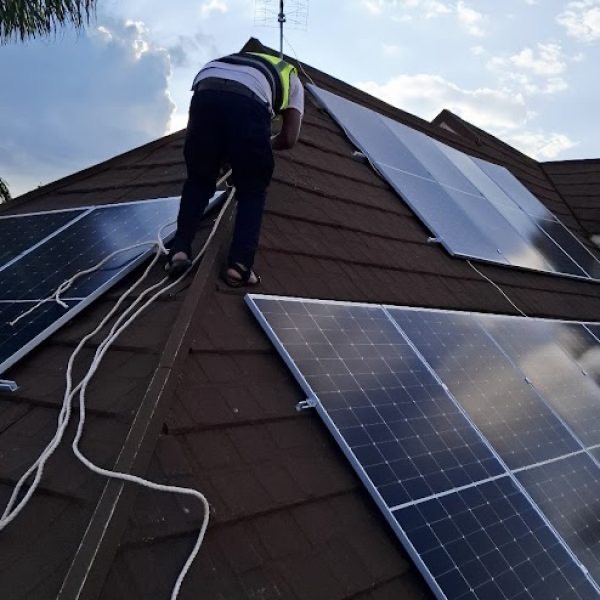 Technician completing a rooftop solar installation