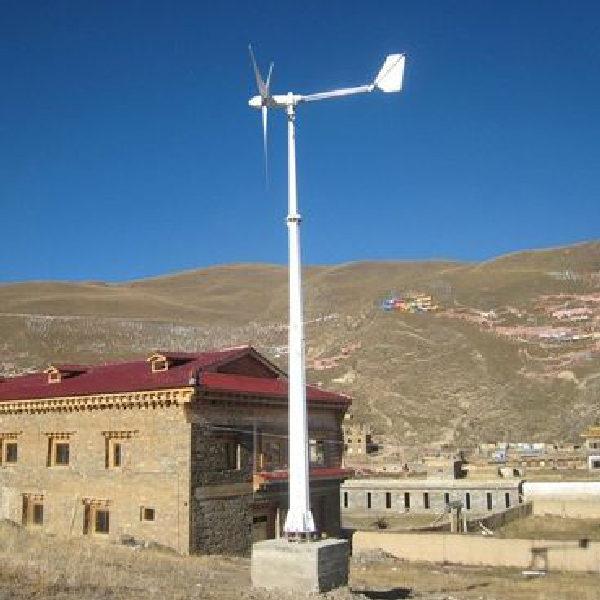 Complete GH-series horizontal-axis wind turbine and monopole installed on a concrete base at a rural supplier reference site